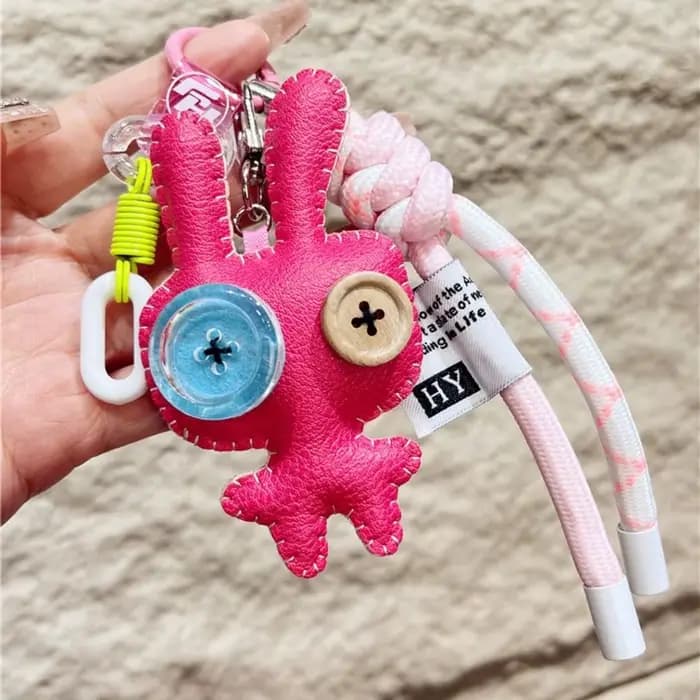 Porte-clés de luxe en cuir PU, drôle, bouton, poupées, pendentif, ornement de sac exquis, accessoires de sac/décor de clé