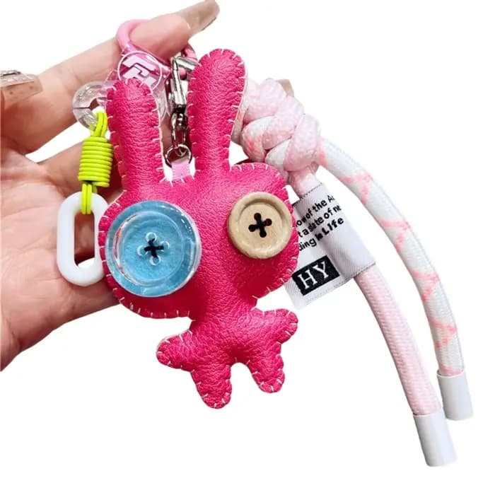 Porte-clés de luxe en cuir PU, drôle, bouton, poupées, pendentif, ornement de sac exquis, accessoires de sac/décor de clé