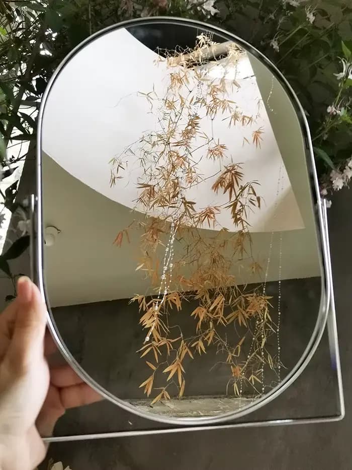 Miroir de maquillage rotatif en métal