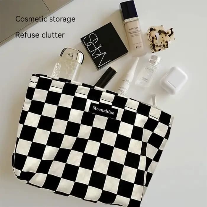 Sac à cosmétiques à carreaux noir et blanc