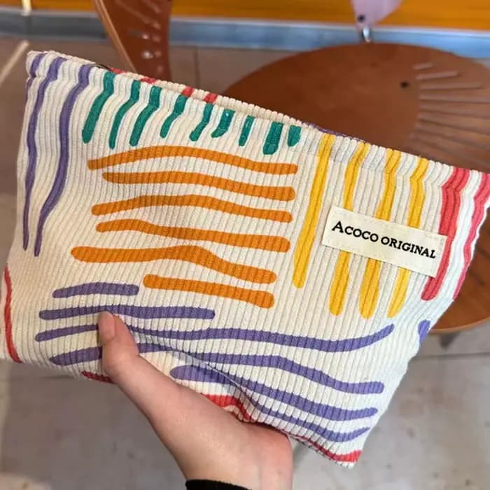 Pochette cosmétique en velours côtelé à rayures colorées