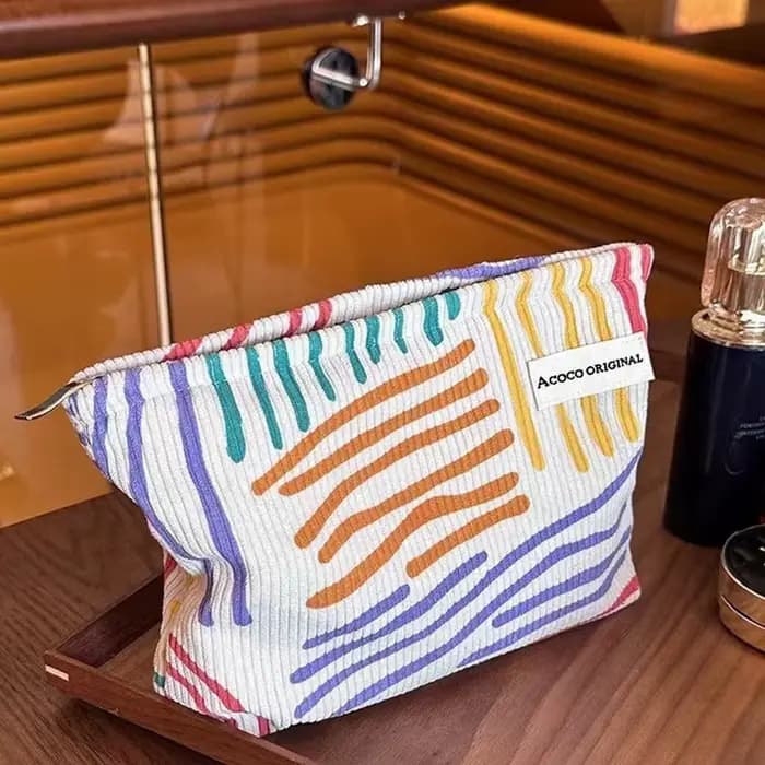 Pochette cosmétique en velours côtelé à rayures colorées