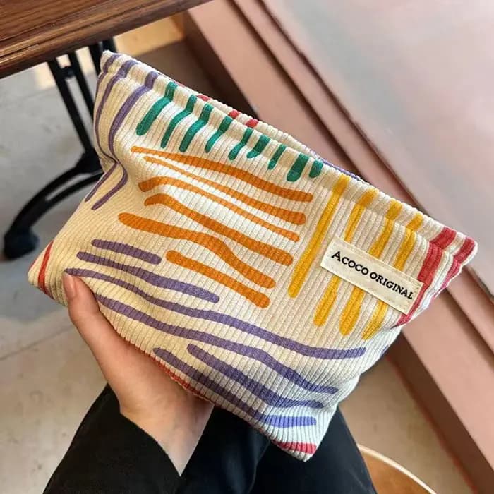 Pochette cosmétique en velours côtelé à rayures colorées